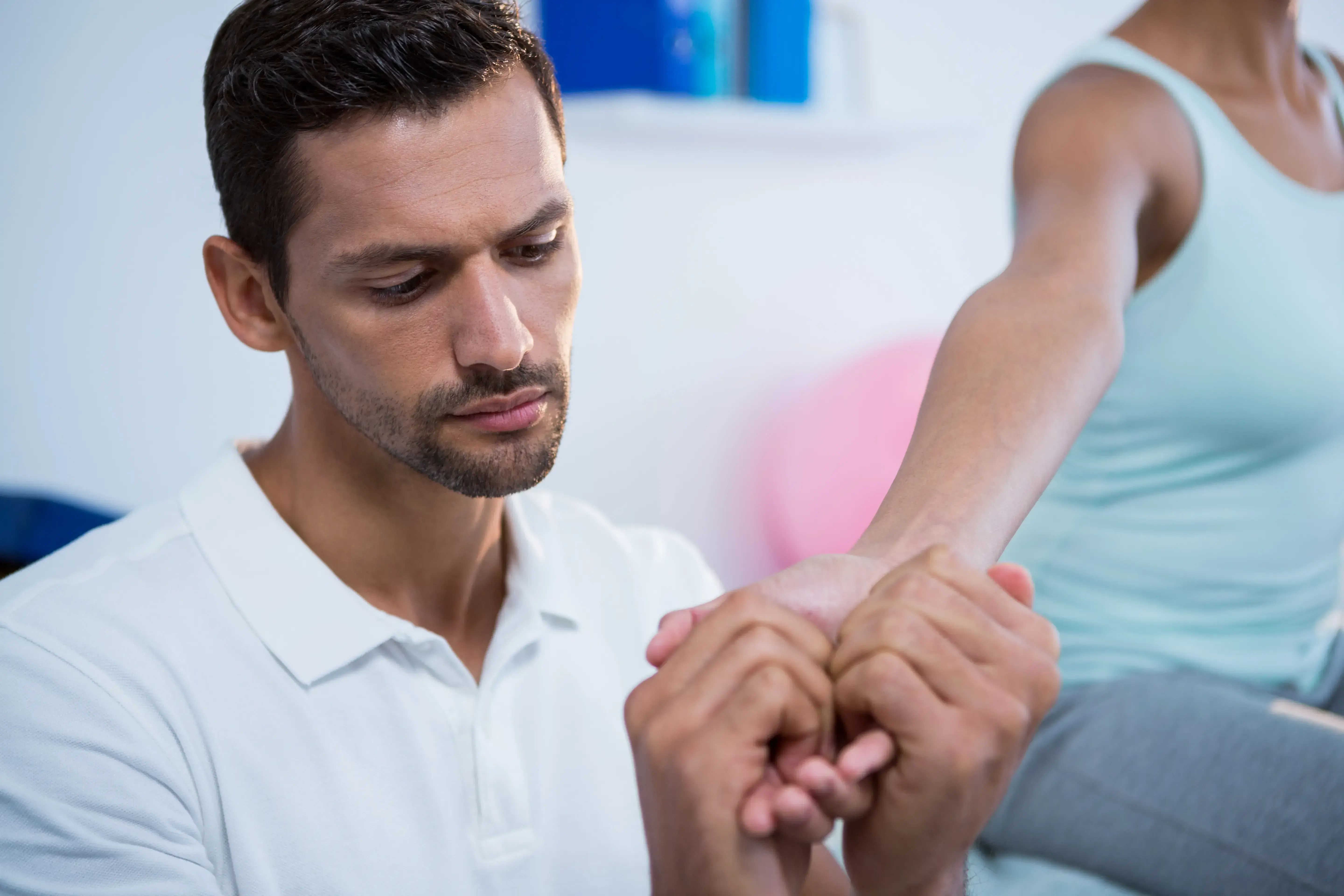 Patient hand examination at Emerald Coast Ortho in Fort Walton Beach, FL